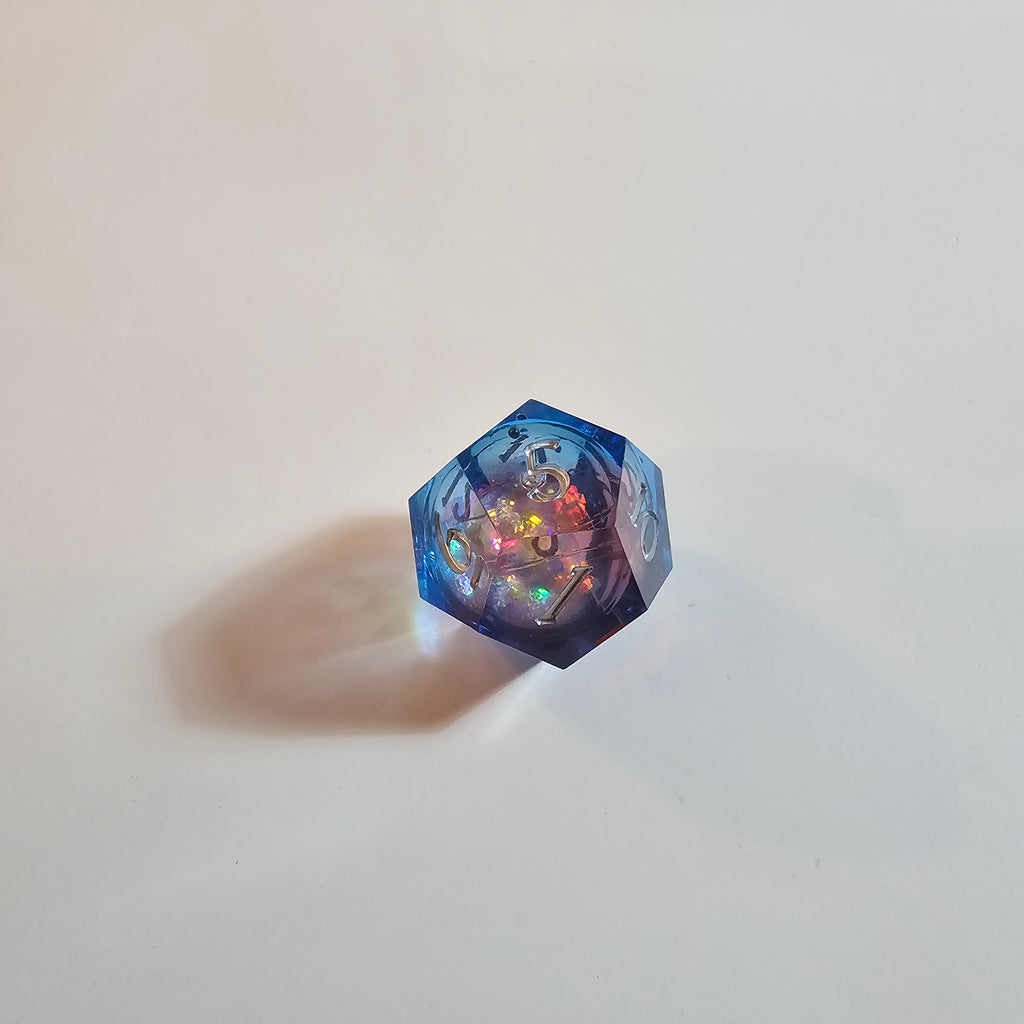 Set di dadi in resina con nucleo liquido Cosmic Firestorm