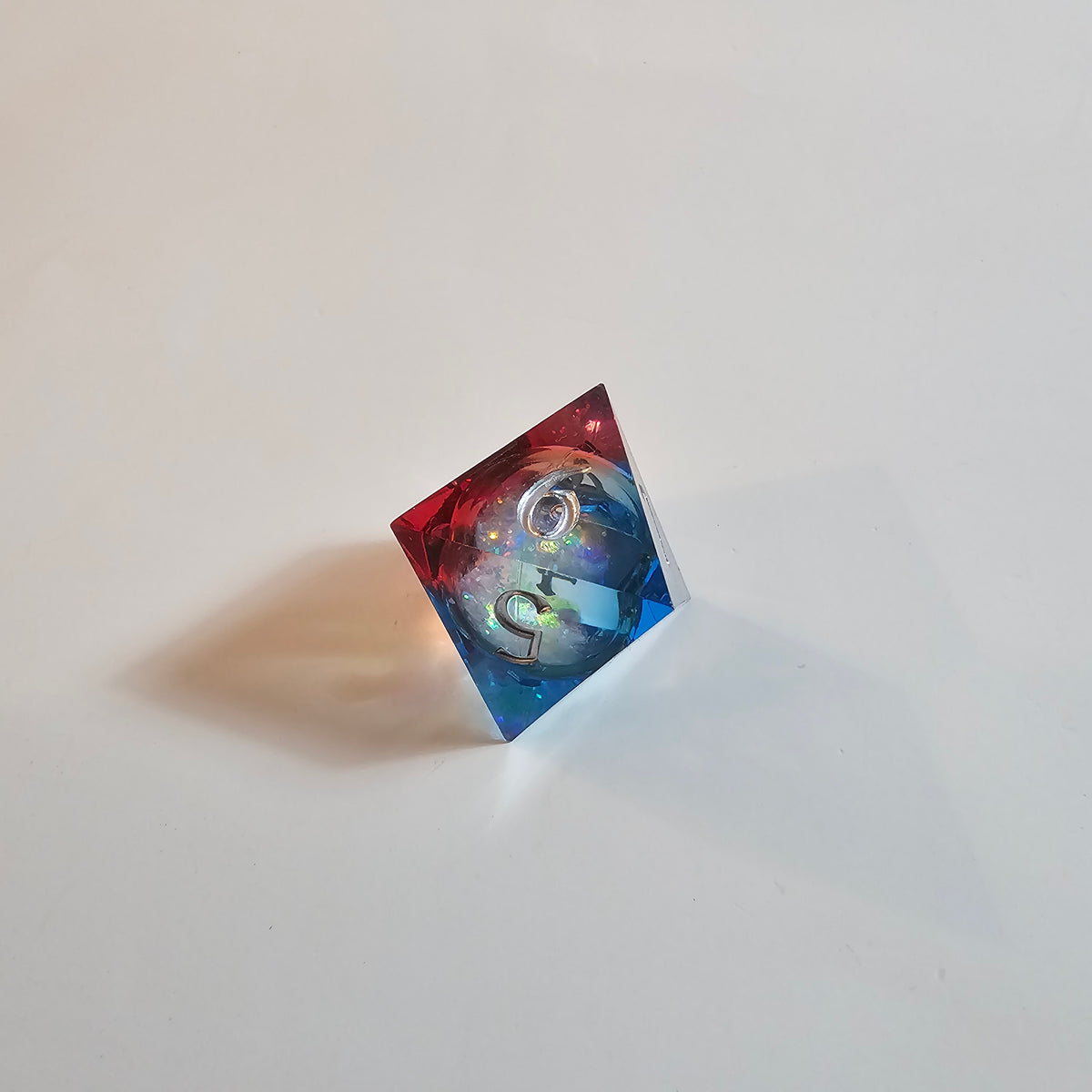 Set di dadi in resina con nucleo liquido Cosmic Firestorm