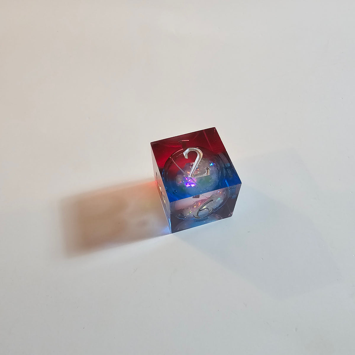 Set di dadi in resina con nucleo liquido Cosmic Firestorm
