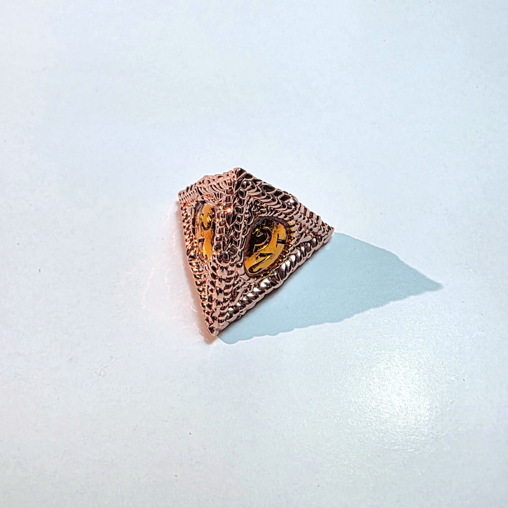 Set di dadi in metallo pieno color oro rosa con occhio d'ambra